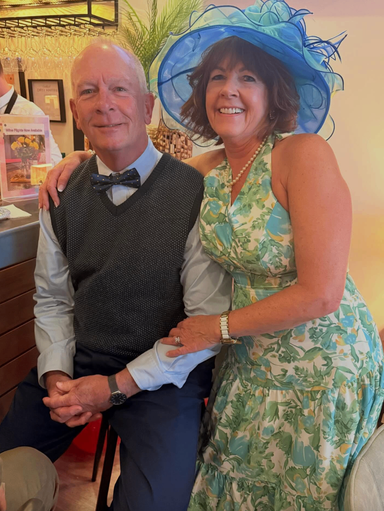 Couple smiling in derby attire