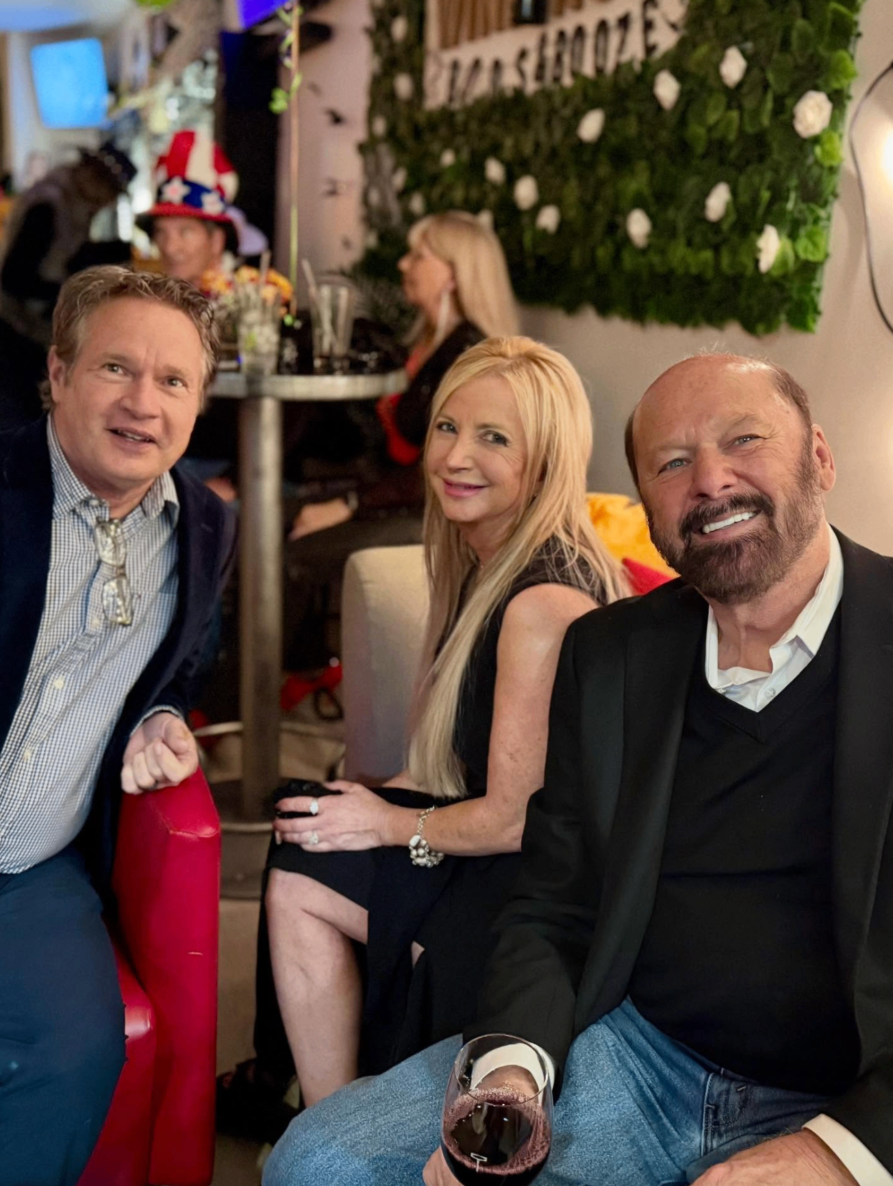 Friends laughing on the lounge at a derby party