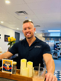 Mark Wimmers, owner of WineNot Wine Bar, behind the bar