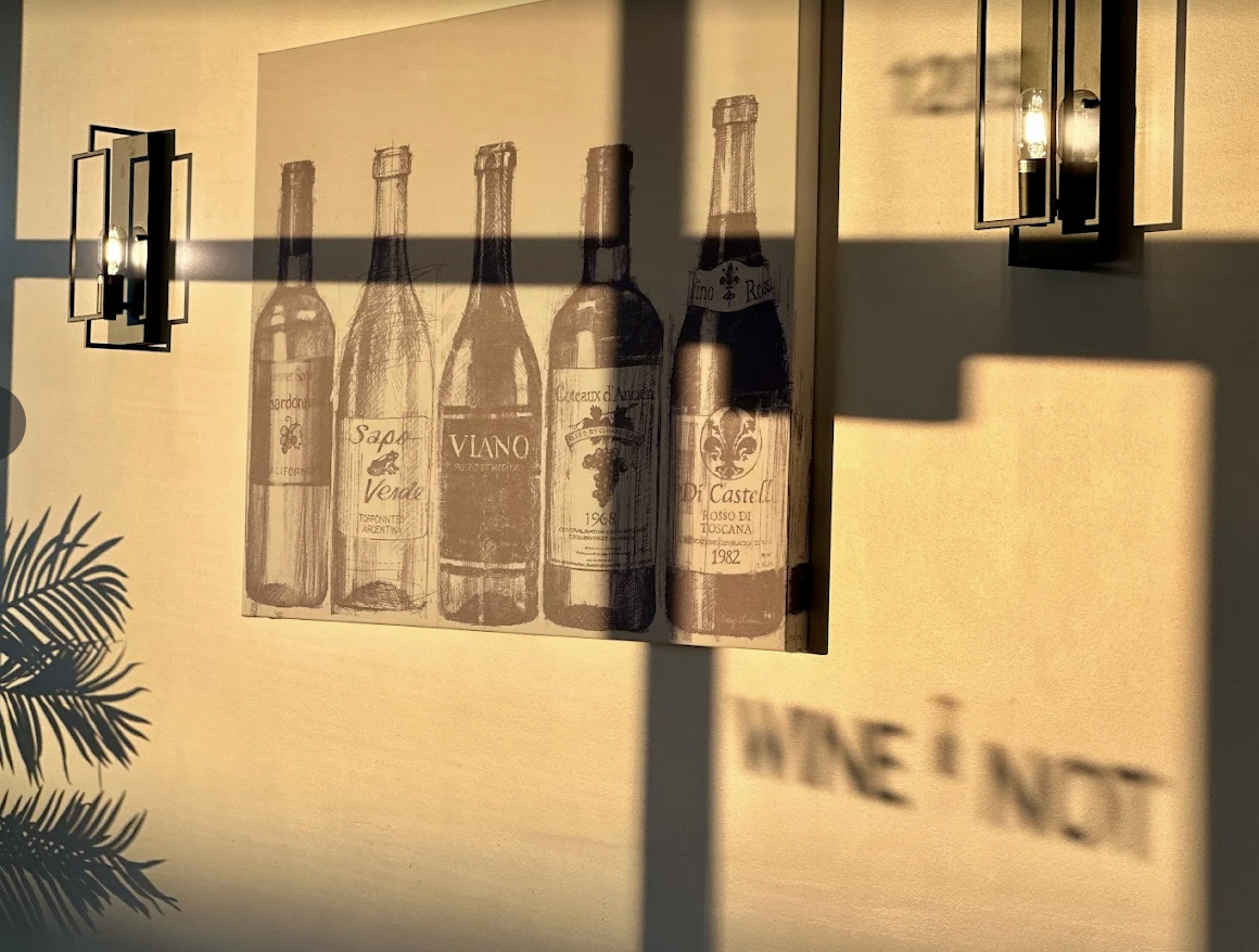 Wine bottles and cozy candlelit table